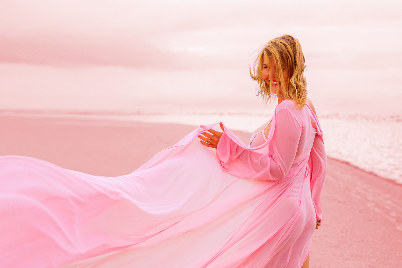 Woman in Pink Dress on the Beach